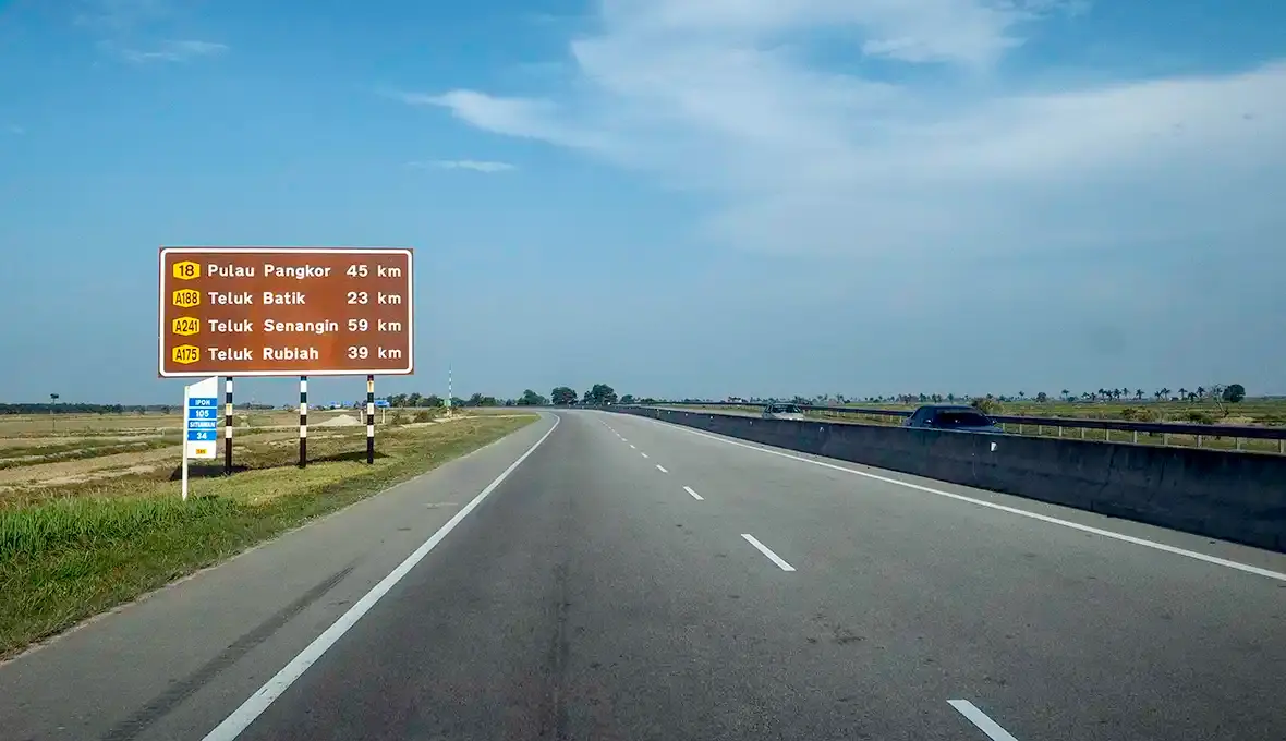 West Coast Expressway heading towards Pangkor with a road sign showing Pulau Pangkor 45 km